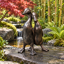 Afbeelding in Gallery-weergave laden, New Bronze ducks pair polyresin ornament in a scenic garden