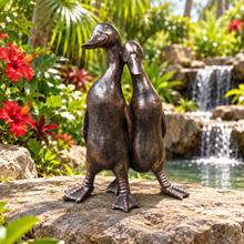 Afbeelding in Gallery-weergave laden, New Bronze ducks pair polyresin ornament in a scenic garden