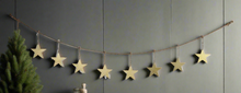 Afbeelding in Gallery-weergave laden, Handmade powder coated hanging gold star garland measuring 150 x 20 x 1cm - Marissa's Garden & Gift