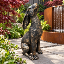 Load image into Gallery viewer, New bronze moon gazing hare ornament beside a modern garden waterfall
