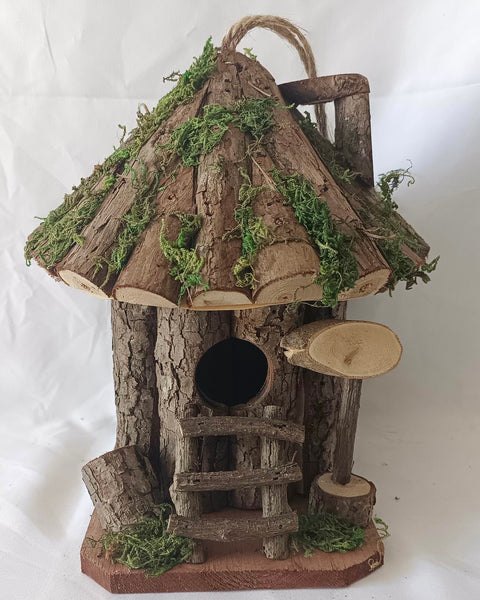 Handmade wooden birdhouse hut with ladder
