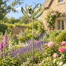 Laden Sie das Bild in den Galerie-Viewer, WS350 Burghley verdigris and gold wind sculpture in an English cottage garden