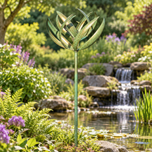 Laden Sie das Bild in den Galerie-Viewer, WS350 Burghley verdigris and gold wind sculpture beside an English garden pond and waterfall