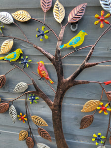 Coloured birds in a heart shaped tree wall art for indoors/outdoors