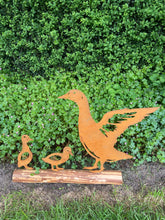 Load image into Gallery viewer, Rusty metal duck and two ducklings displayed on a log of wood
