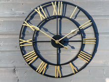 Load image into Gallery viewer, Black Skeleton frame outdooor/Indoor clock with gold hands and gold numerals
