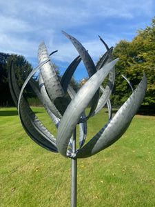Burghley garden wind sculpture spinner silver with black brush