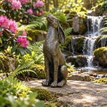 Laden Sie das Bild in den Galerie-Viewer, Moon gazing hare garden ornament in aged gold finish, 38 cm tall, in a landscaped garden
