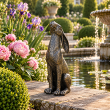 Laden Sie das Bild in den Galerie-Viewer, Moon gazing hare garden ornament in aged gold finish, 38 cm tall, in a landscaped garden
