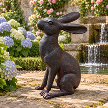 Charger l'image dans la galerie, Alert Hare ornament with hydrangeas and waterfall in a traditional walled garden
