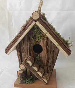 Handmade wooden birdhouse hut with ladder
