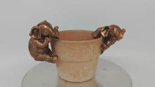 Load and play video in Gallery viewer, Polyresin pair of bronze coloured elephant pot hangers
