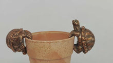 Load and play video in Gallery viewer, Polyresin pair of bronze coloured turtle pot hangers
