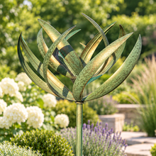 Laden Sie das Bild in den Galerie-Viewer, WS350 Burghley verdigris and gold wind sculpture in a contemporary English garden
