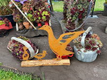 Load image into Gallery viewer, Rusty metal duck and two ducklings displayed on a log of wood
