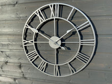Load image into Gallery viewer, Silver framed Skeleton clock with silver numerals and silver hands
