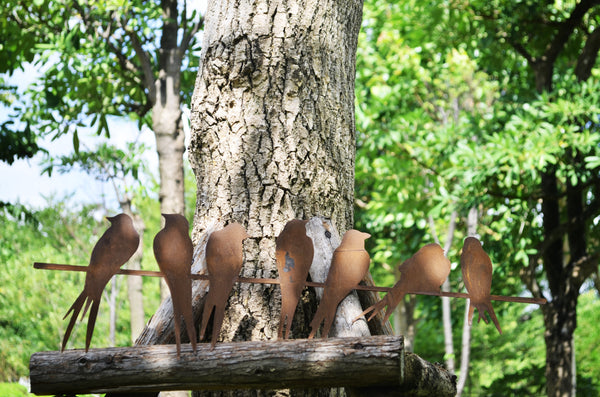 Handmade seven rusty birds perched on a straight branch for garden/outdoor measuring 70 x 2.5 x 21cm.