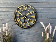 Laden Sie das Bild in den Galerie-Viewer, Oversized Gold and black Skeleton outdoor/indoor clock

