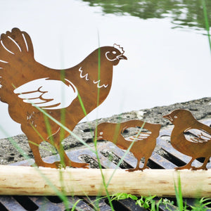 Rusty mother metal chicken with two baby chicks on a log of wood measuring   45 x 12.5 x 35cm