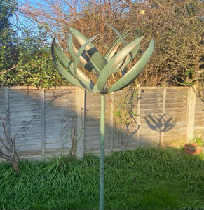 Burghley garden wind sculpture spinner verdigris