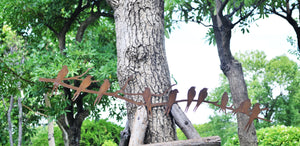 Handmade ten rusty birds perched on a branch 110cm